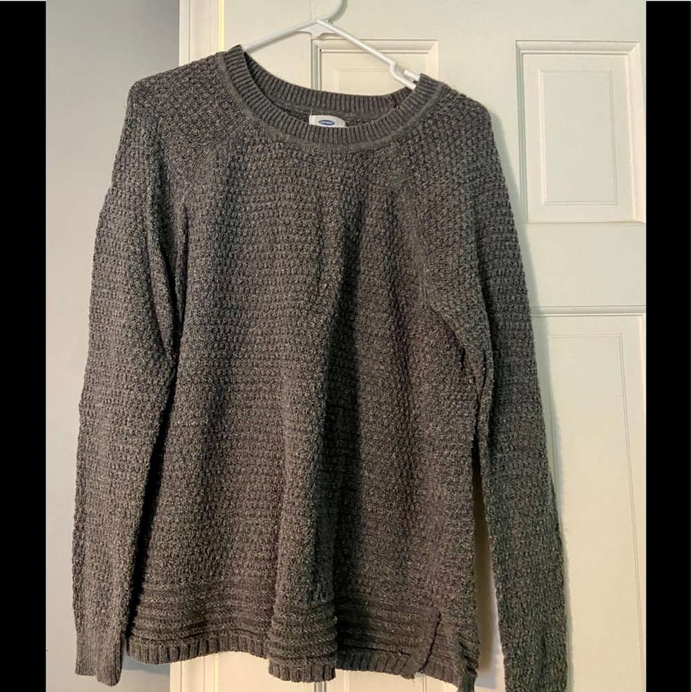 Grey crew neck sweater.